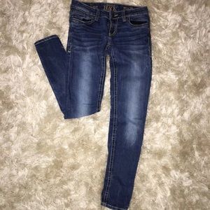 Buckle black skinny jeans